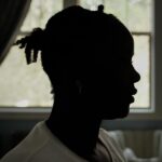 Silhouette portrait of a female asylum-seeker